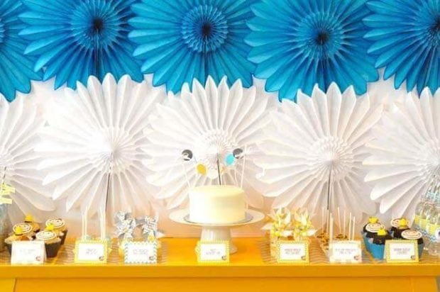 The dessert table at this Curious George birthday party featured bright colors and modern details as well as incredible treats