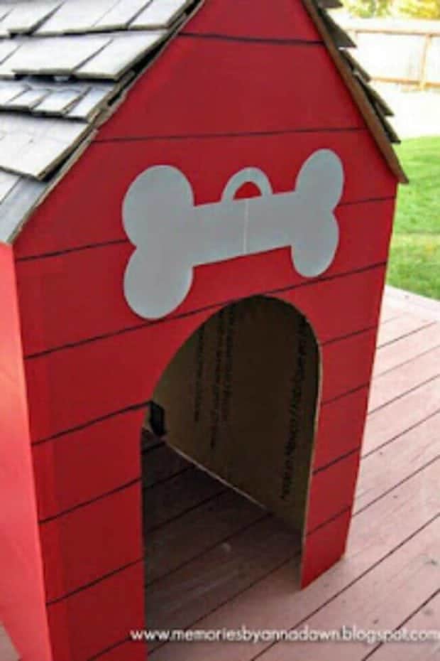 DIY Cardboard Doghouse for a dog-themed children's party.