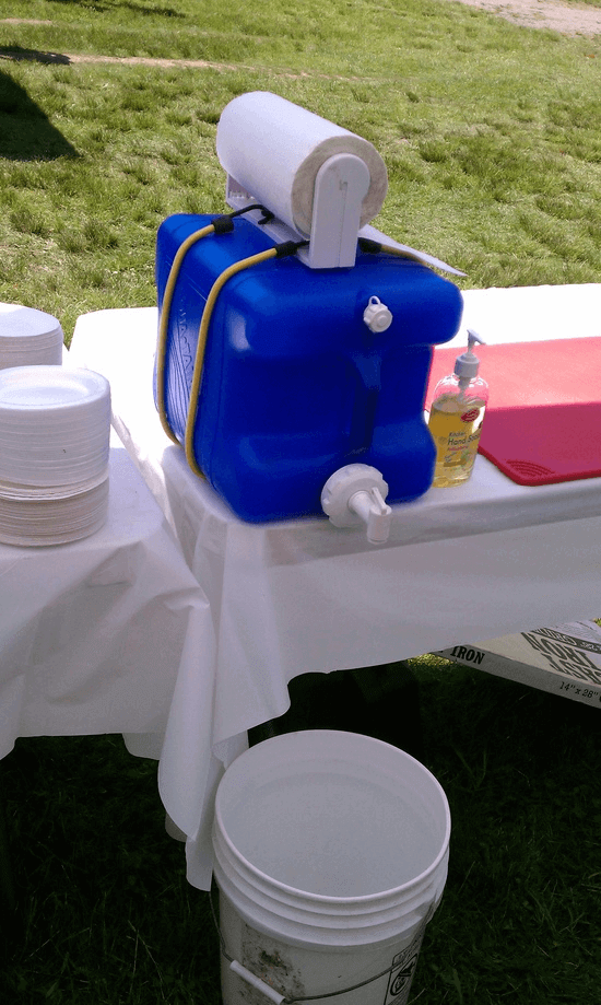 Keep hands clean while camping using this simple DIY hand washing station.