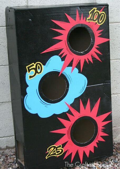 Transform a beanbag toss game with this fun cardboard accessory.