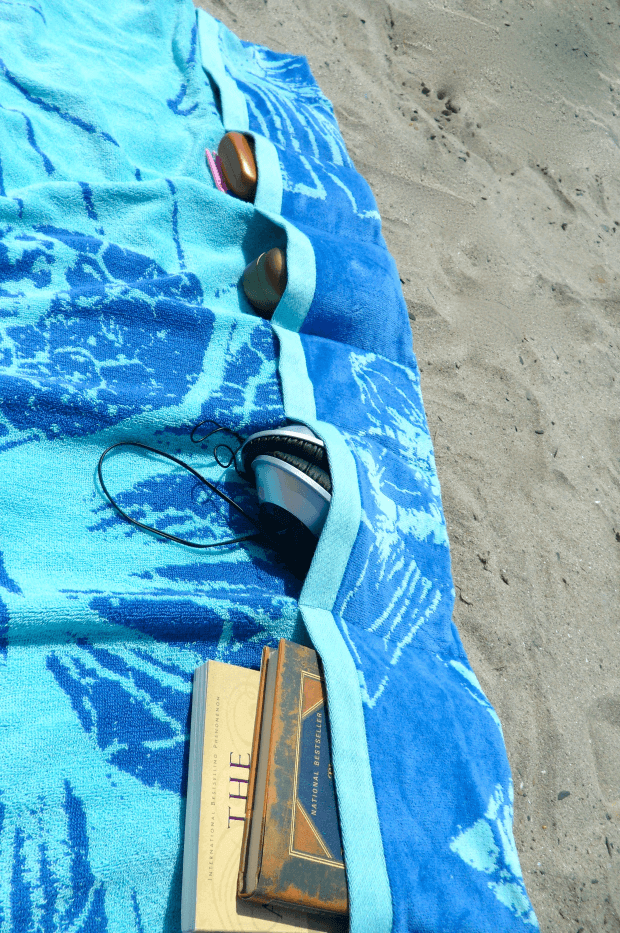 This DIY beach hack results in Pocketed Beach Towels to keep things organized while you relax.
