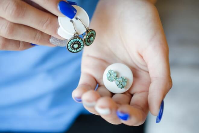 Use buttons to keep sets of earrings together while travelling.