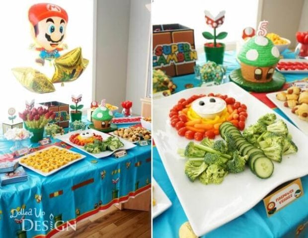 Fun party foods decorate this Mario Brothers table. Delicious party food doesn't have to be unhealthy.