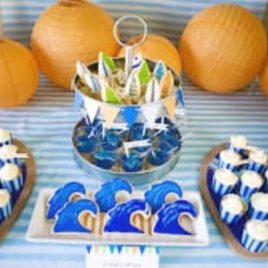 A bowl of oranges on a table, with Birthday and Party