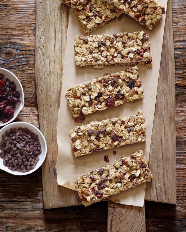 Food on a wooden cutting board, with Granola Bar