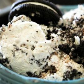 A close up of a bowl of food, with Cream and Oreo