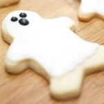 A wooden cutting board, with Cookie and Ghost