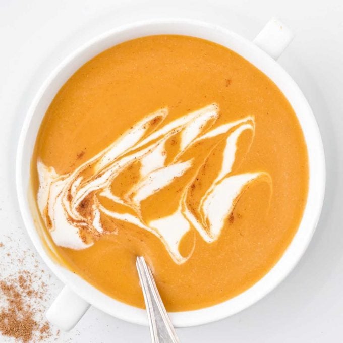 close up overhead shot of a cup of butternut squash soup