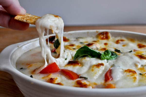 No guest will be able to resist this melty hot caprese dip.