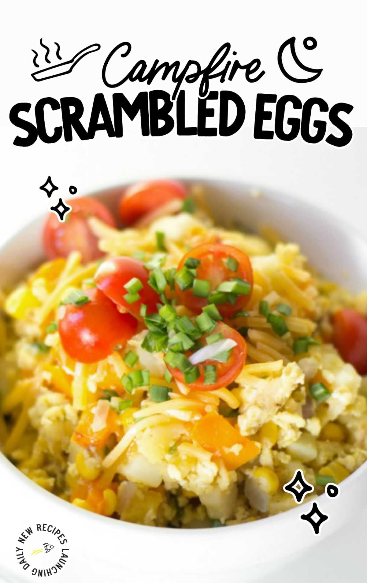 Campfire Scrambled Eggs topped with herbs