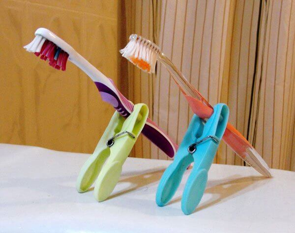 Use pegs to make a simple DIY travel toothbrush holder