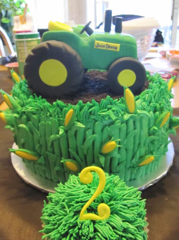 A train cake sitting on top of a wooden table