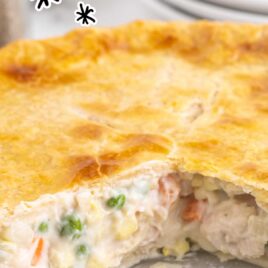 close up shot of Chicken Pot Pie with a slice missing in a baking dish