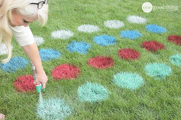 A little girl that is standing in the grass