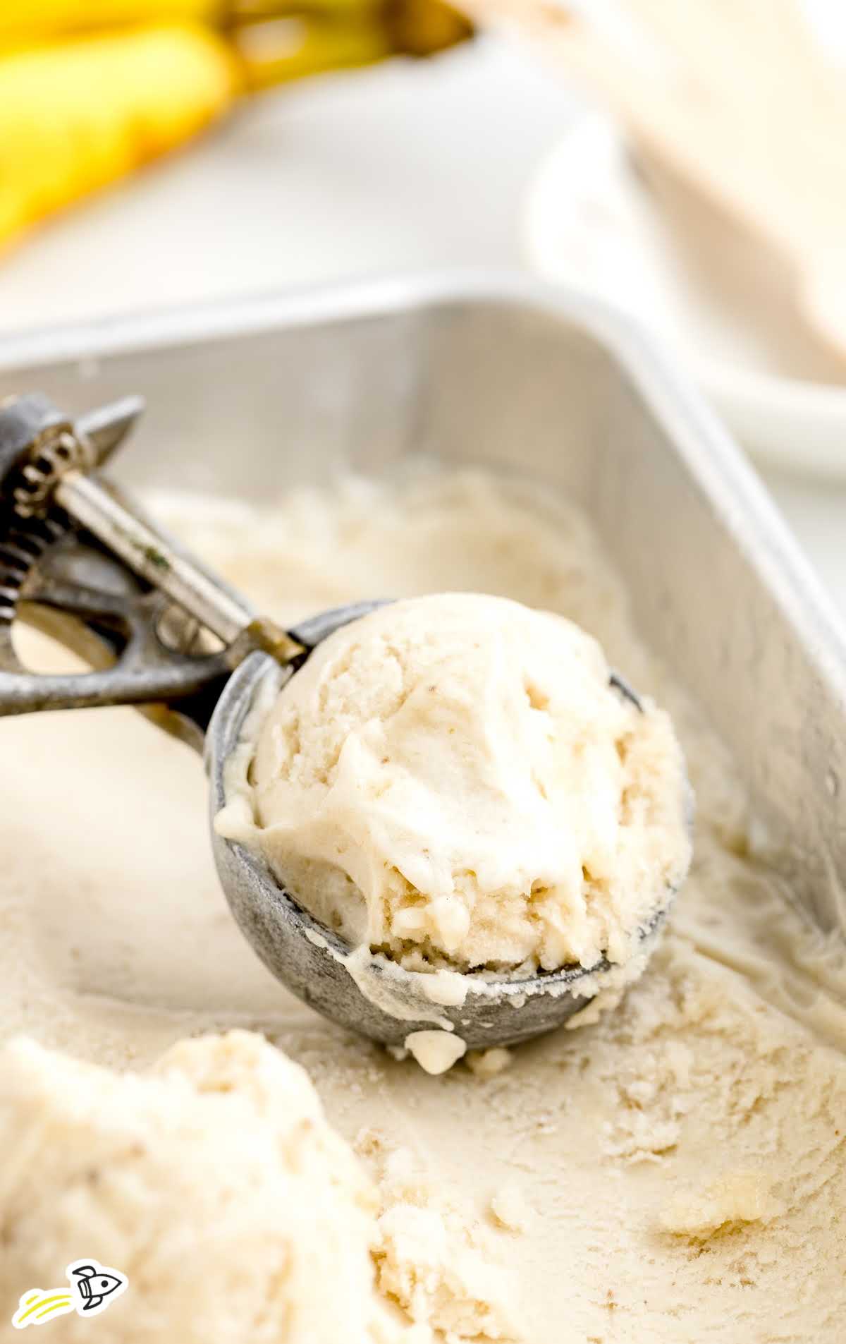 close up shot of Banana Ice Cream being scooped from a loaf pan