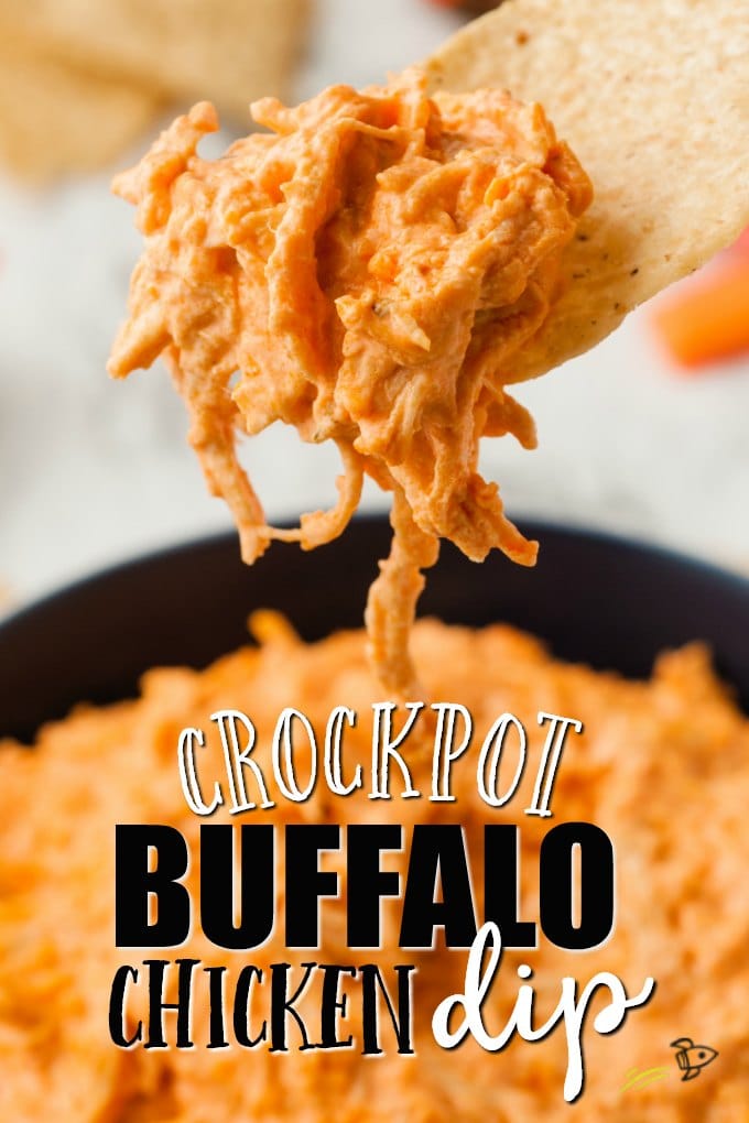 Tortilla being dipped into buffalo chicken dip