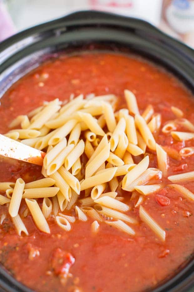 A close up of a bowl of noodles with sauce, with Soup and Slow cooker