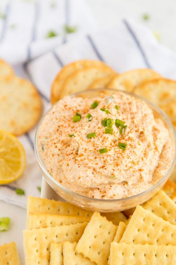 A plate of food, with Crab dip and Cheese