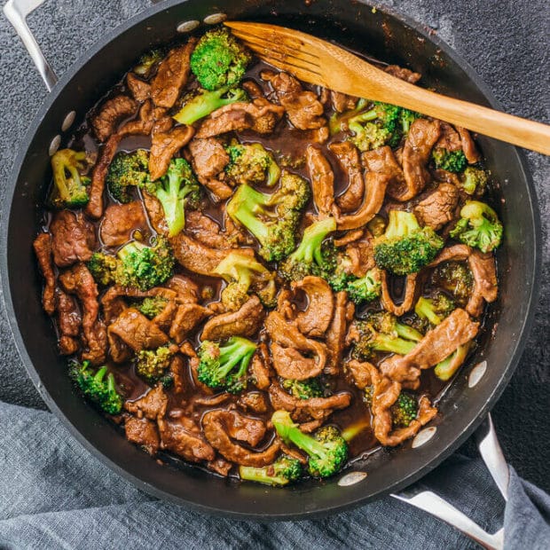A pan filled with meat and vegetables, with Beef and Broccoli