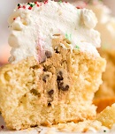 A close up of a piece of cake on a plate, with Chocolate chip cookie