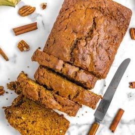 close up overhead shot of a loaf of Pumpkin Banana Bread with slices cut out