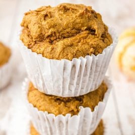 close up shot of 2-ingredient Pumpkin Spice Muffins stacked on top of each other