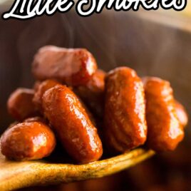close up shot of Instant Pot Little Smokies on a large wooden spoon