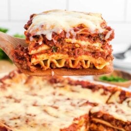 close up shot of a serving of Lasagna on a spatula