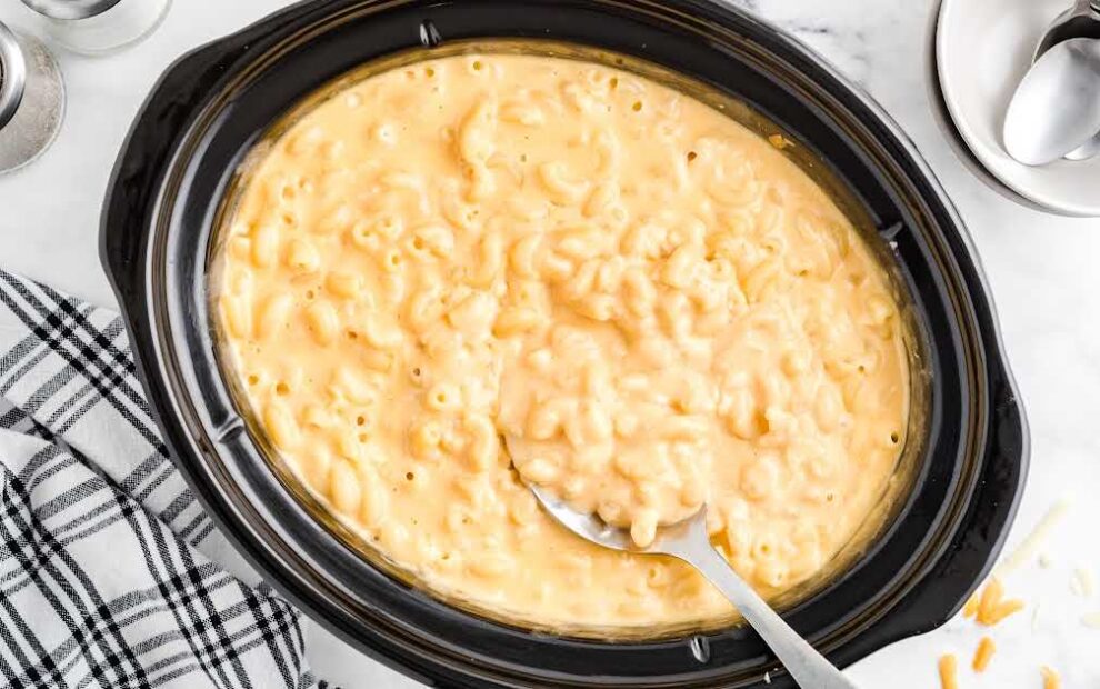 close up shot of Crockpot Mac and Cheese in a crockpot with a spoon