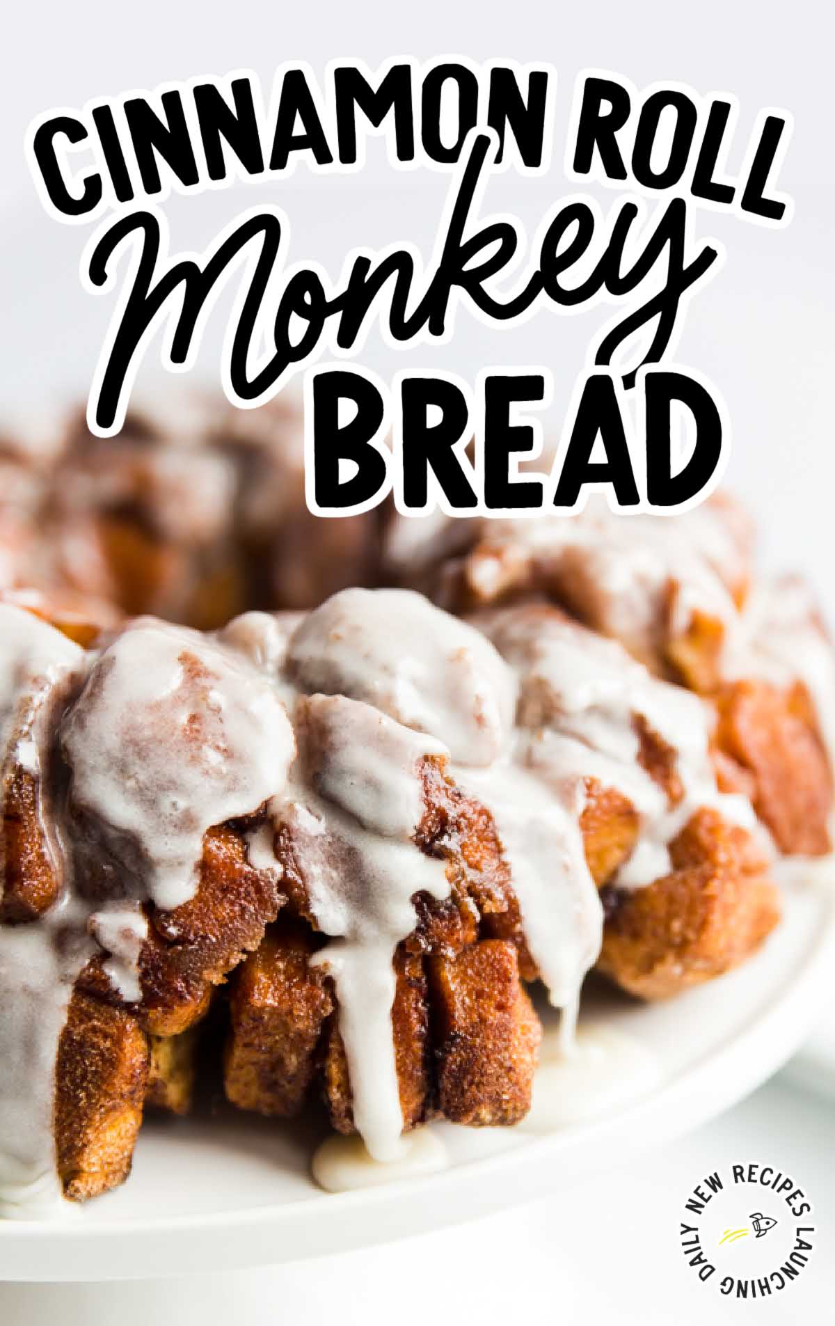Overhead view of glazed cinnamon roll monkey bread on a cake stand