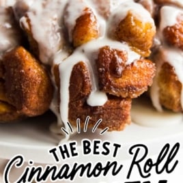 Pin image labeled the best cinnamon roll monkey bread with close-up of gooey glazed bread