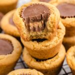 close up shot of Peanut Butter Cookie Cups piled on top of each other