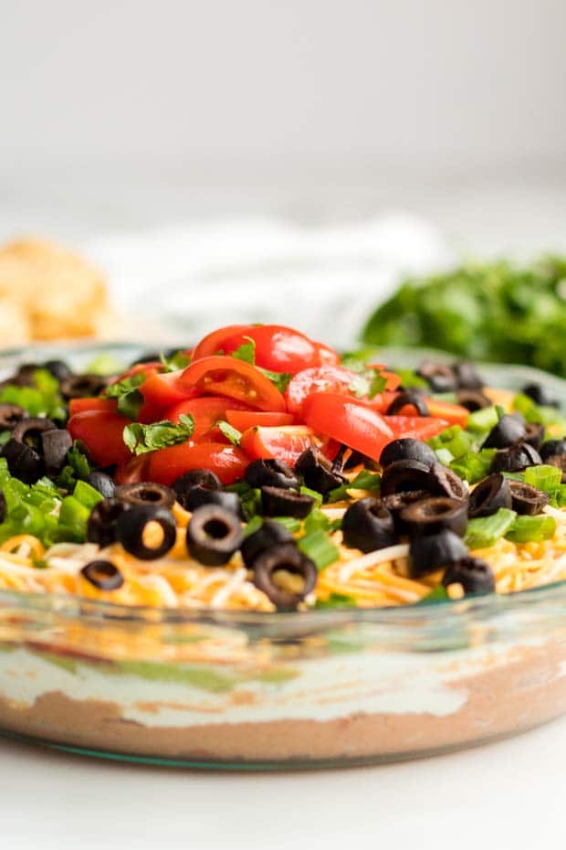 close up of toppings on seven layer dip