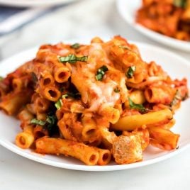 A plate full of food, with Baked ziti