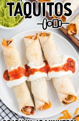 close up overhead shot of taquitos topped with sour cream and salsa on a plate