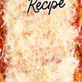 overhead shot of a baking dish of baked ziti topped with cheese