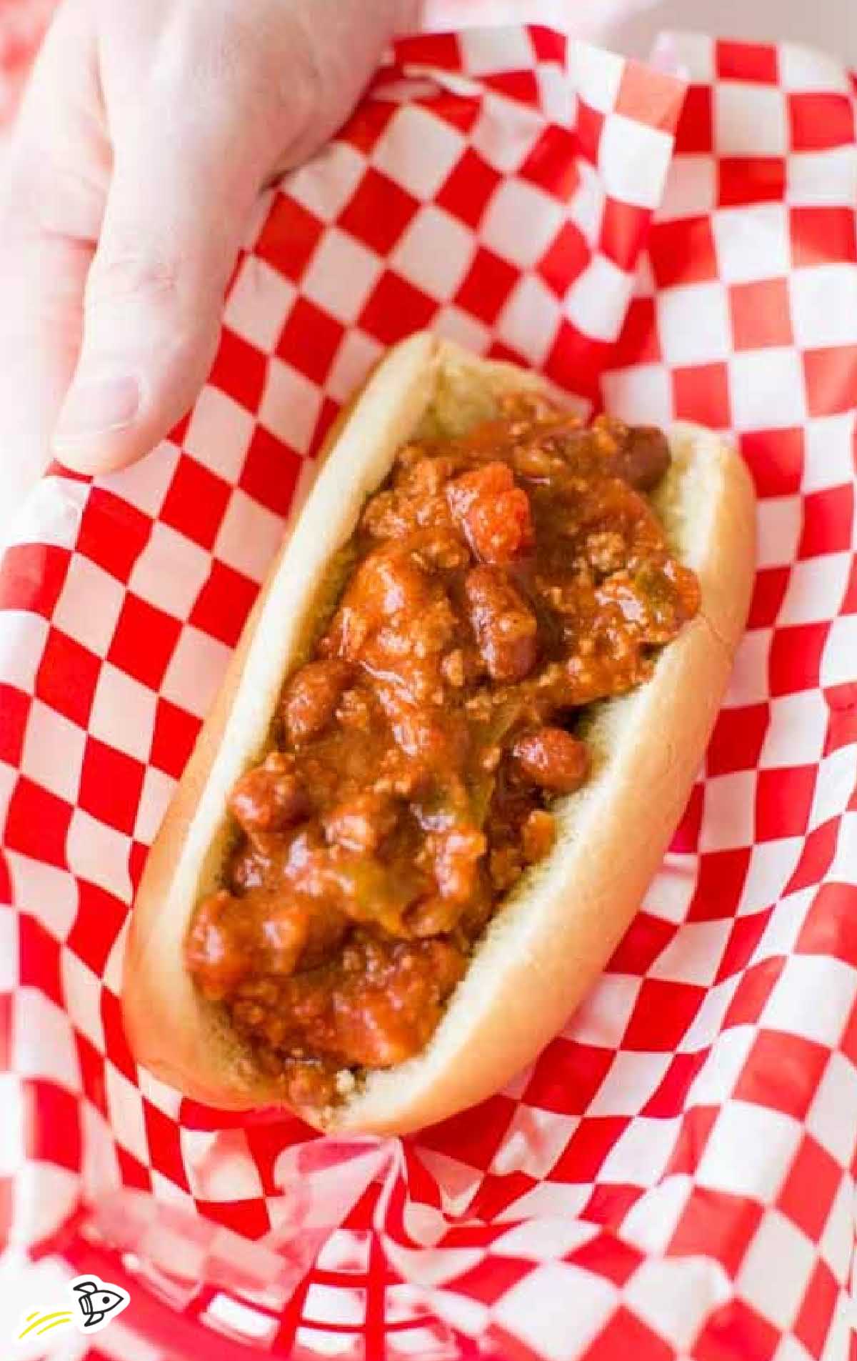 overhead shot of a hot dog topped with chili