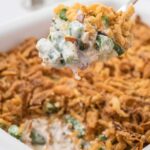 close up shot of Green Bean Casserole in a casserole dish and on a spoon