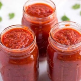 close up shot of jars of homemade tomato sauce