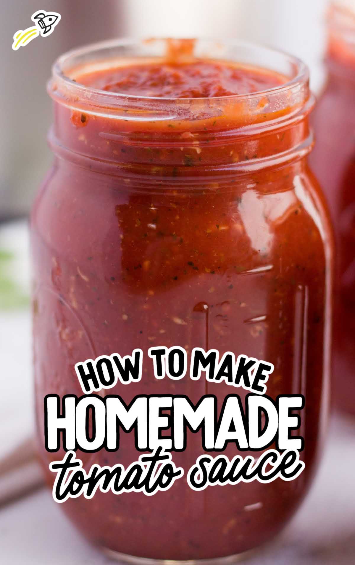 close up shot of a jar of homemade tomato sauce