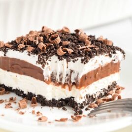 a close up shot of Chocolate Lasagna with a bite taken out of it