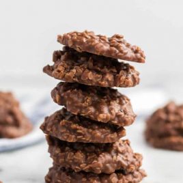 A close up of a piece of cake on a plate, with Cookie and Peanut