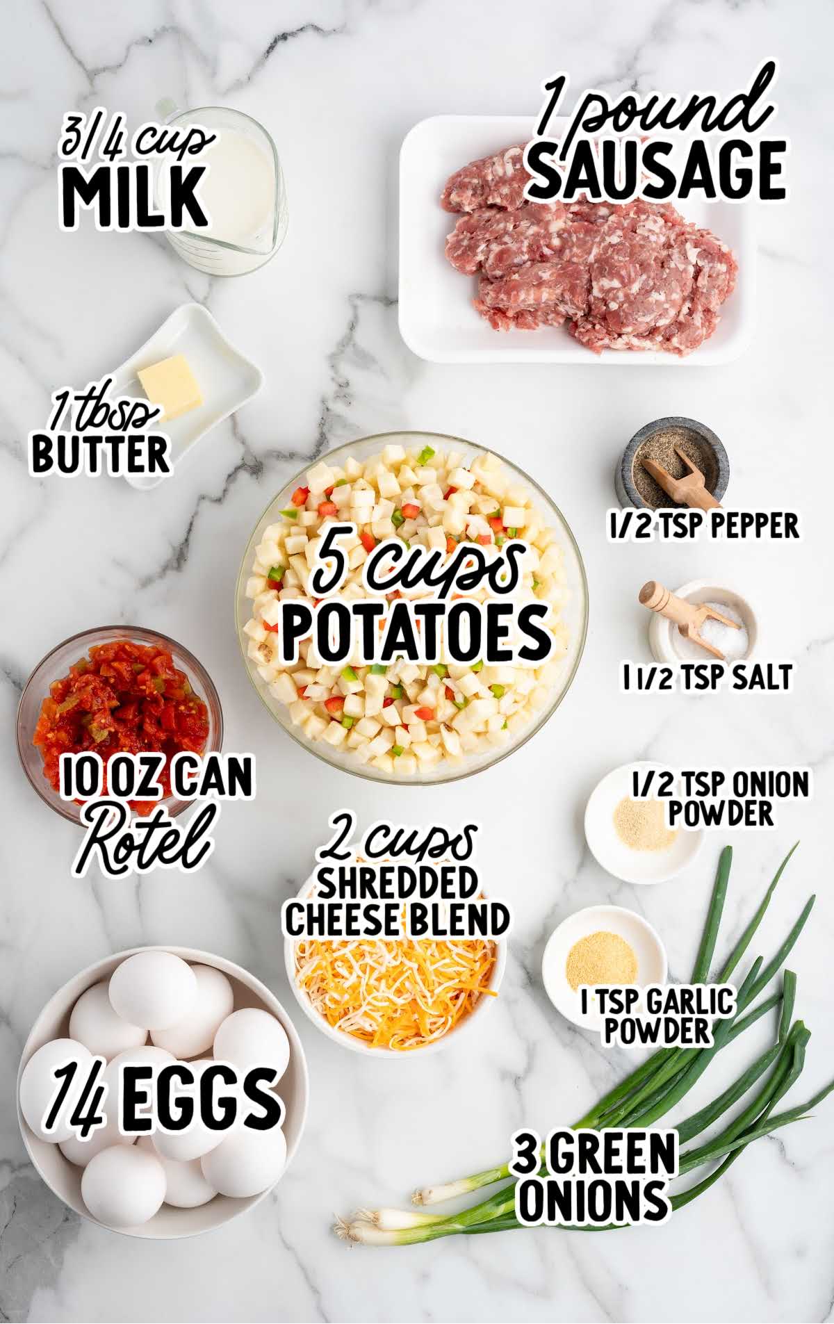 Overhead view of sausage breakfast casserole ingredients including sausage, potatoes, eggs, cheese, Rotel, and green onions.