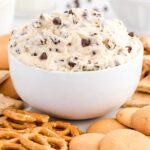 close up shot of a bowl of Cookie Dough Dip served around pretzels and vanilla wafers