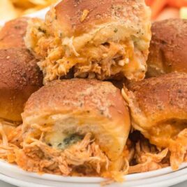 close up shot of Buffalo Chicken Sliders piled on a plate