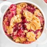 close up overhead shot of a bowl of Cherry Pineapple Dump Cake