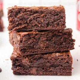 close up side shot of Dr Pepper Brownies stacked on top of each other