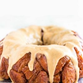 close up shot of Peanut Butter Monkey Bread topped with glaze