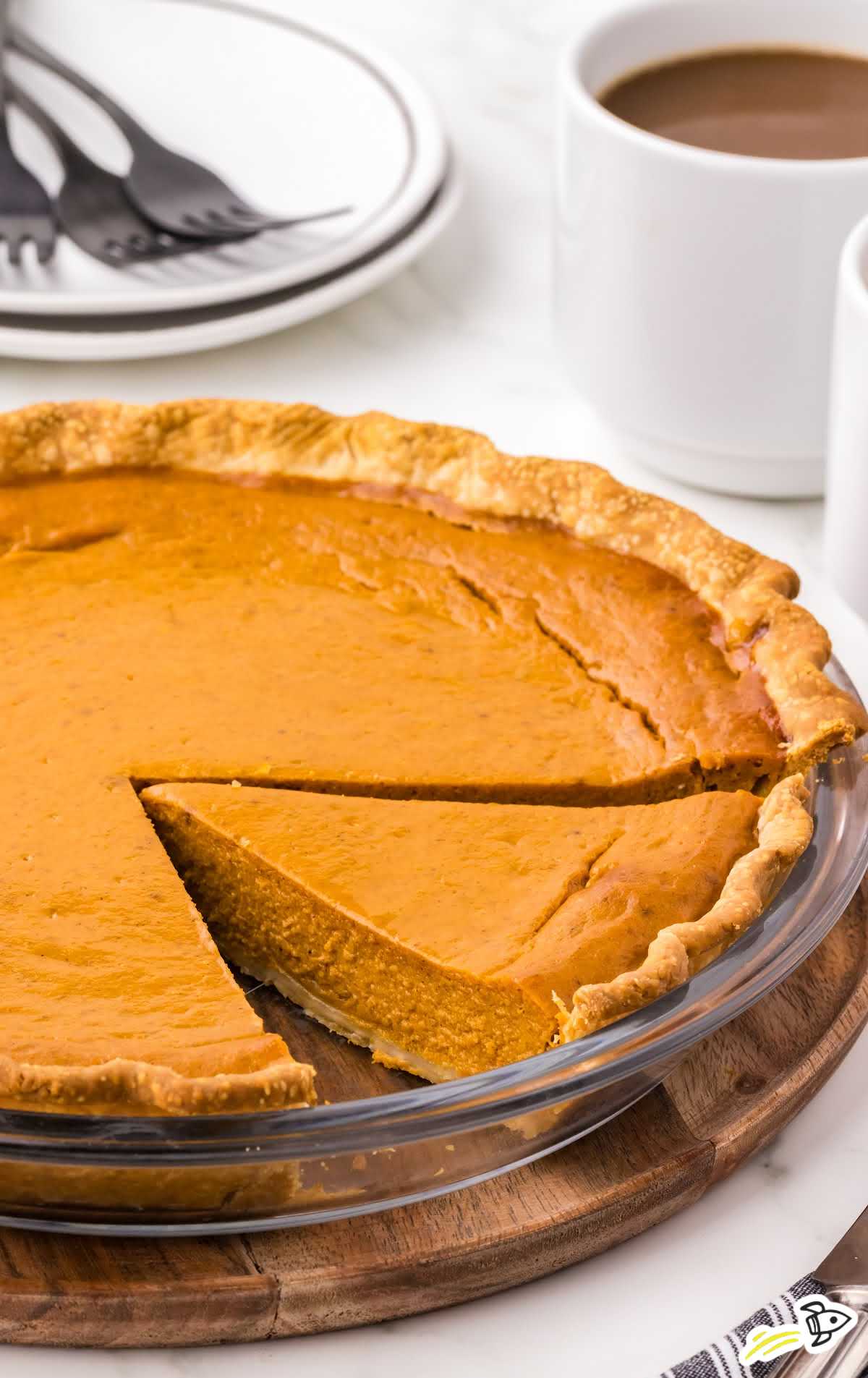 a Pumpkin Pie with a slice cut out