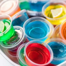 close up shot of cups of jello shots in a bowl